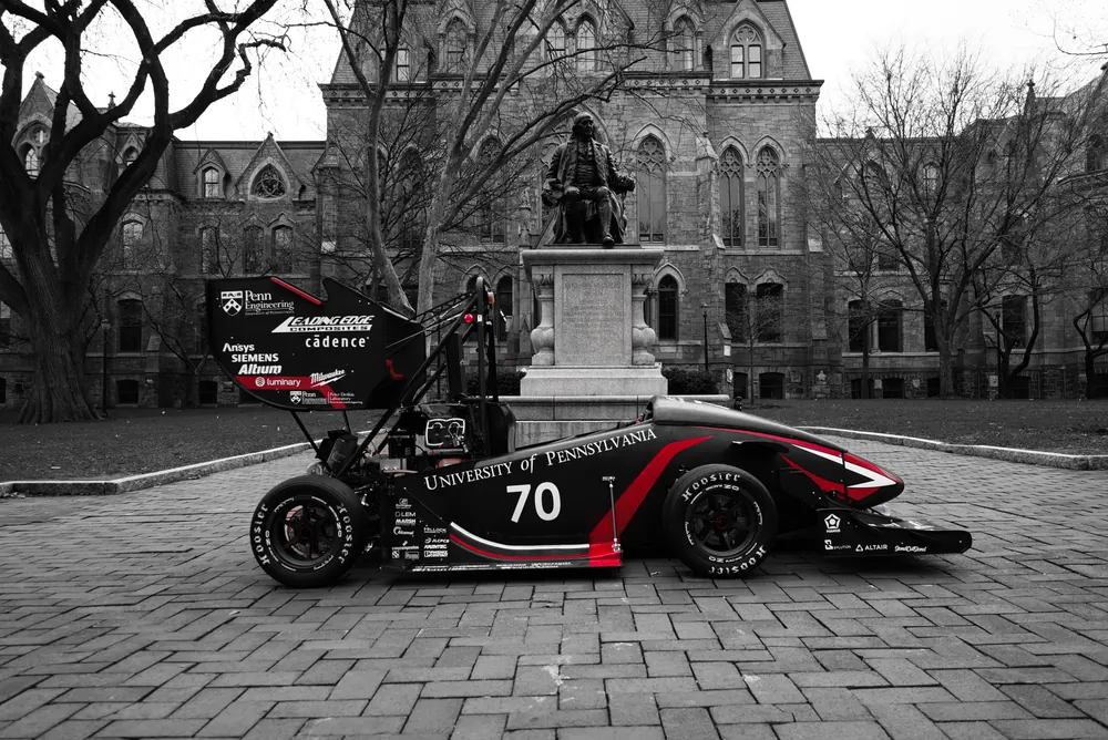 REV11, car number 70, parked in front of the Ben Franklin statue on Penn's campus